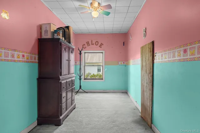 a view of front door and bedroom