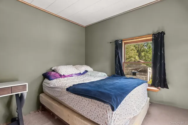 a bathroom with a toilet a sink and a window