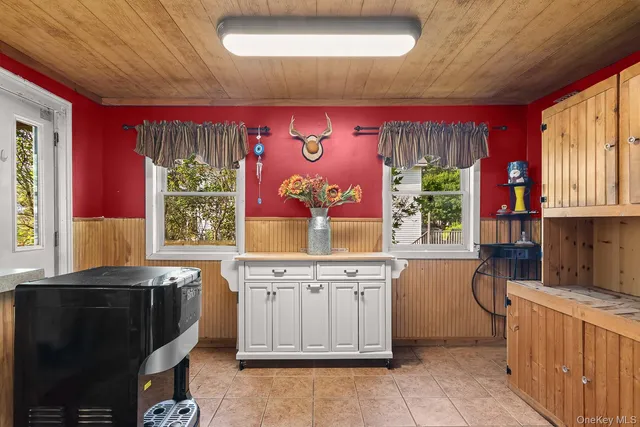 a kitchen with a stove a sink and a microwave