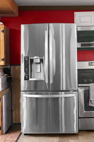 a view of a kitchen with wooden floor