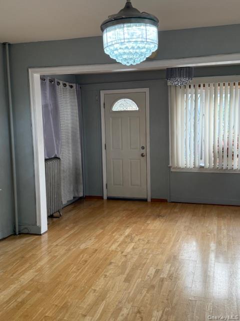 104-27 124th Street Queens, NY 11419 - Photo 4 of 7 a view of an empty room with a window