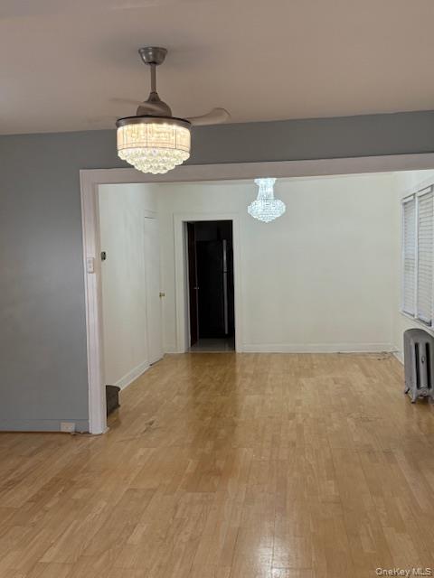 104-27 124th Street Queens, NY 11419 - Photo 6 of 7 a view of an empty room with a chandelier fan