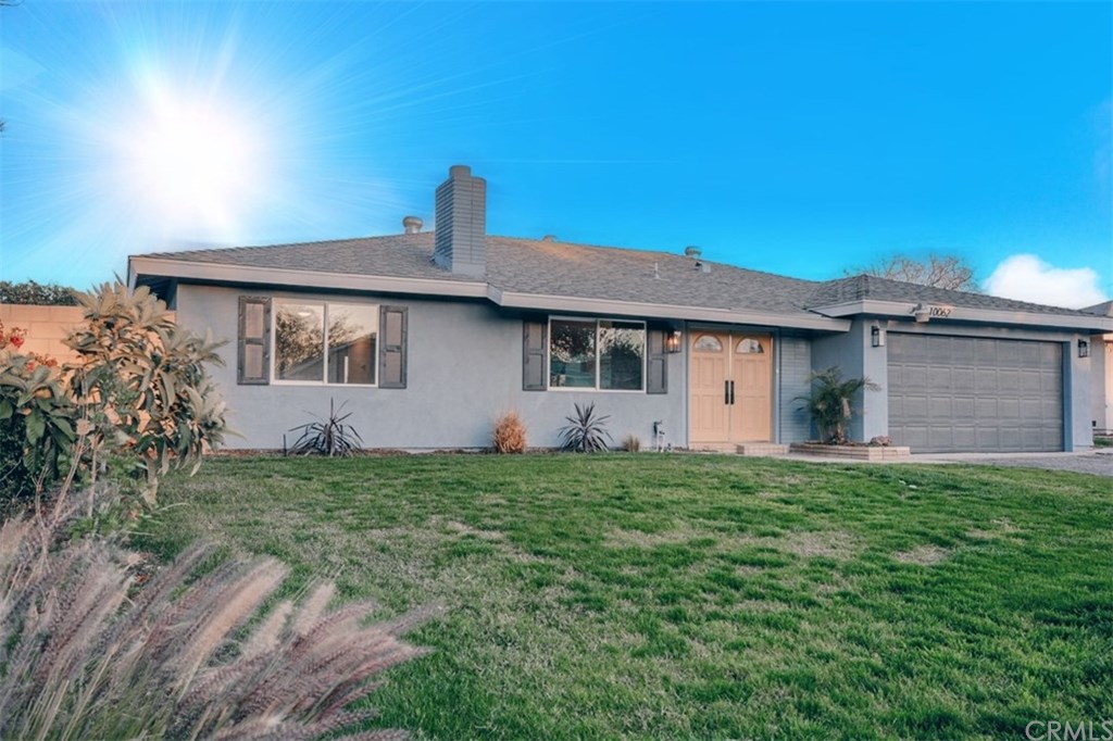 10062 Hedrick Avenue Riverside, CA 92503 - Photo 1 of 1 a front view of a house with a garden