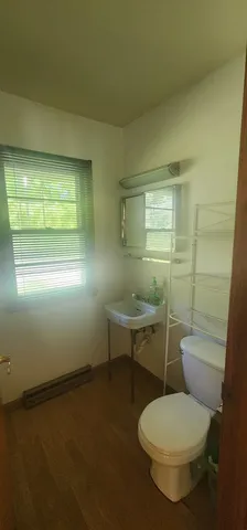 a bathroom with a toilet and a sink
