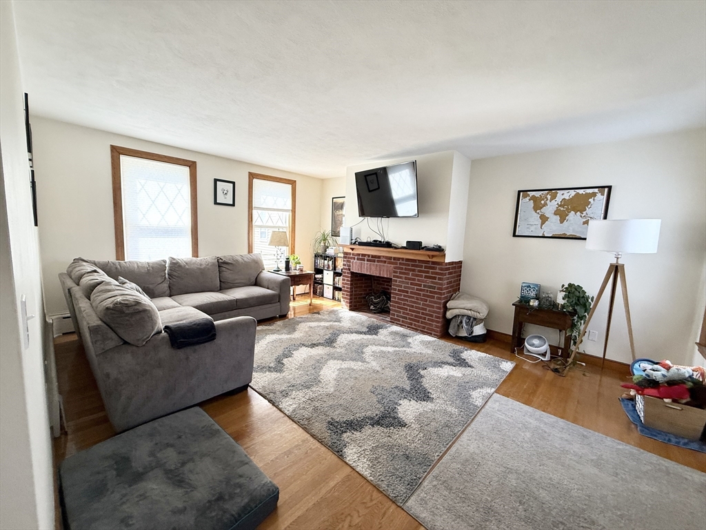 920 East 4th Street, Unit 2 Boston, MA 02127 - Photo 1 of 11 a living room with furniture window and a flat screen tv