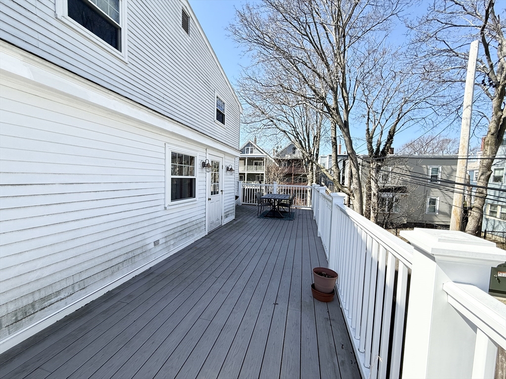 920 East 4th Street, Unit 2 Boston, MA 02127 - Photo 10 of 11 a view of a house with wooden deck
