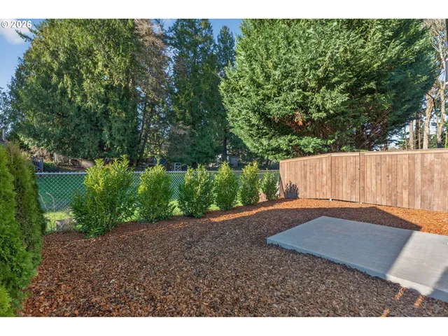 a backyard of a house with lots of green space