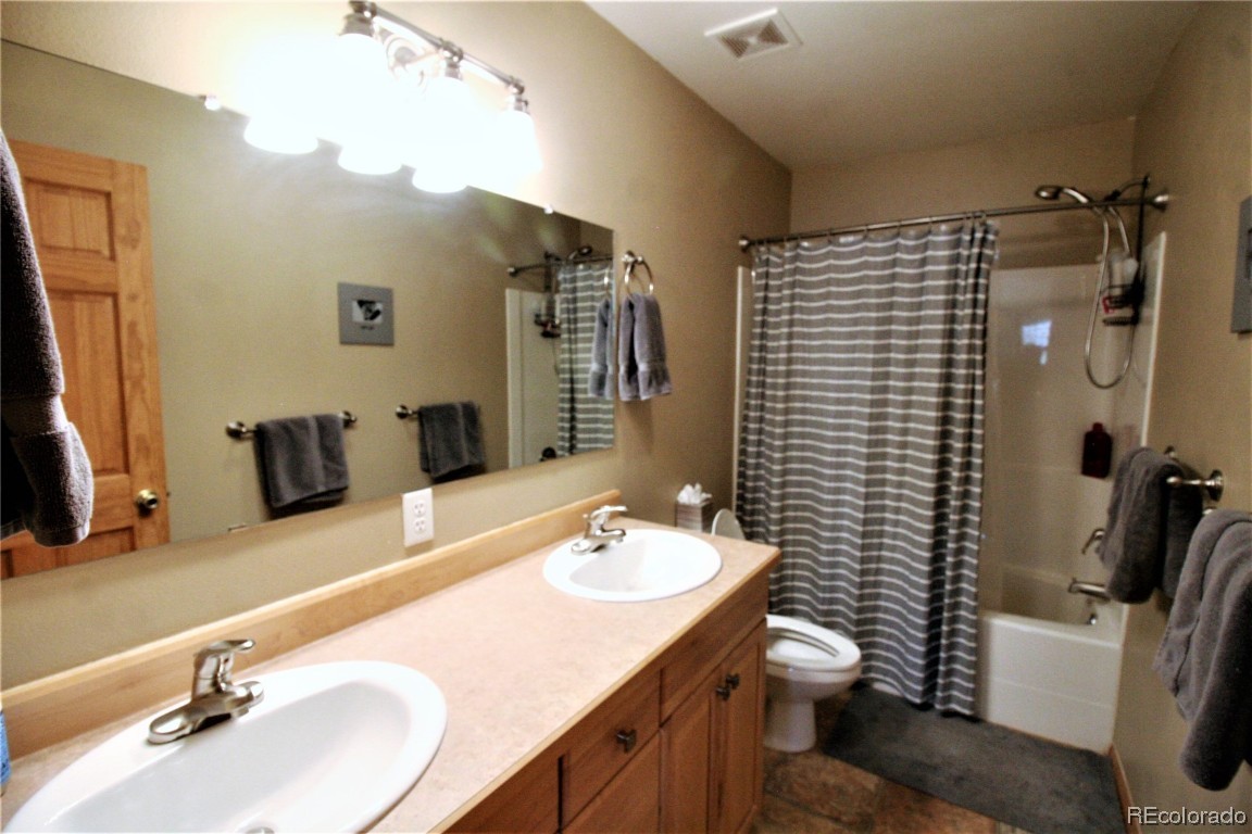 310 Honeysuckle Drive Hayden, CO 81639 - Photo 11 of 22 a bathroom with a sink double vanity and a mirror
