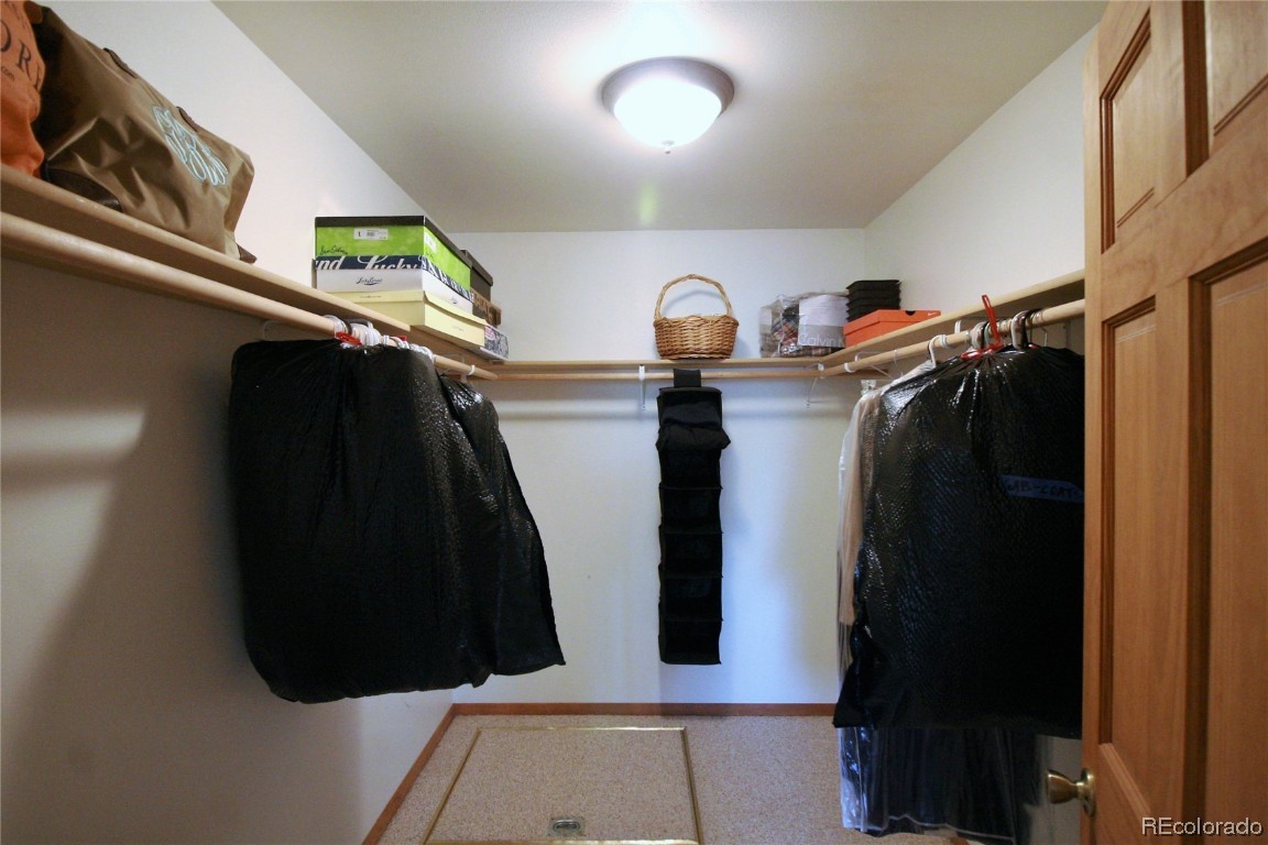 310 Honeysuckle Drive Hayden, CO 81639 - Photo 12 of 22 a view of walk in closet with clothes and shoes
