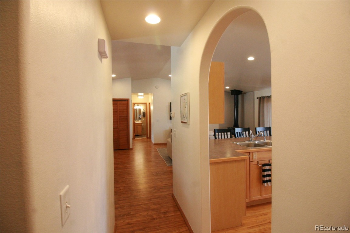 310 Honeysuckle Drive Hayden, CO 81639 - Photo 13 of 22 a view of a hallway with wooden floor