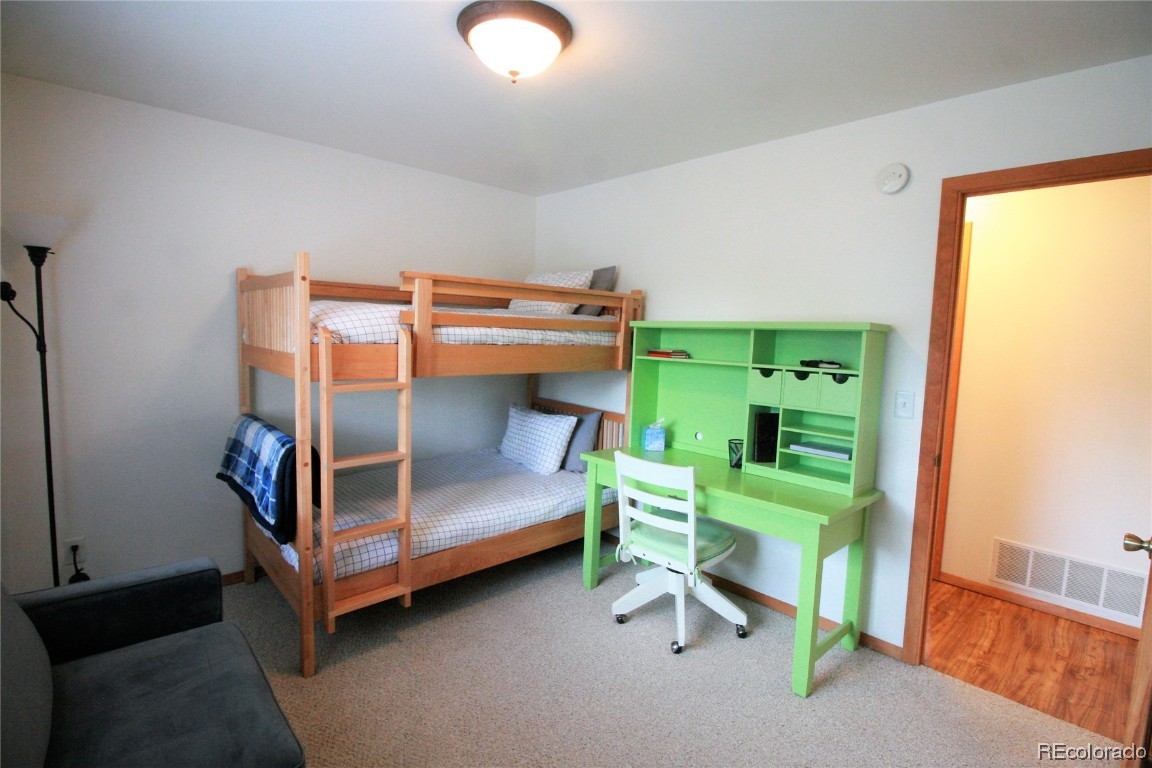 310 Honeysuckle Drive Hayden, CO 81639 - Photo 15 of 22 a bedroom with two bunk beds and a window