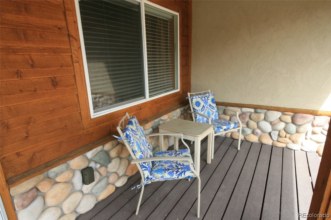 310 Honeysuckle Drive Hayden, CO 81639 - Photo 2 of 22 a view of balcony with wooden floor and outdoor seating