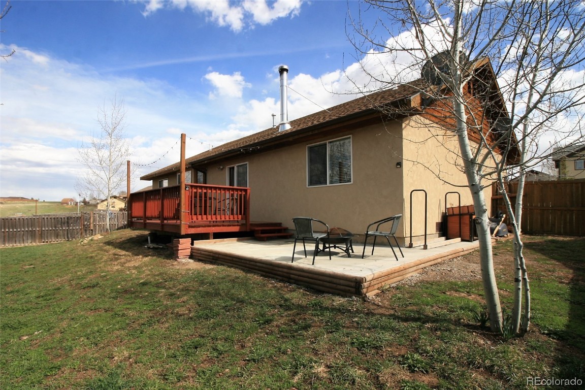 310 Honeysuckle Drive Hayden, CO 81639 - Photo 21 of 22 a view of a house with backyard and sitting area