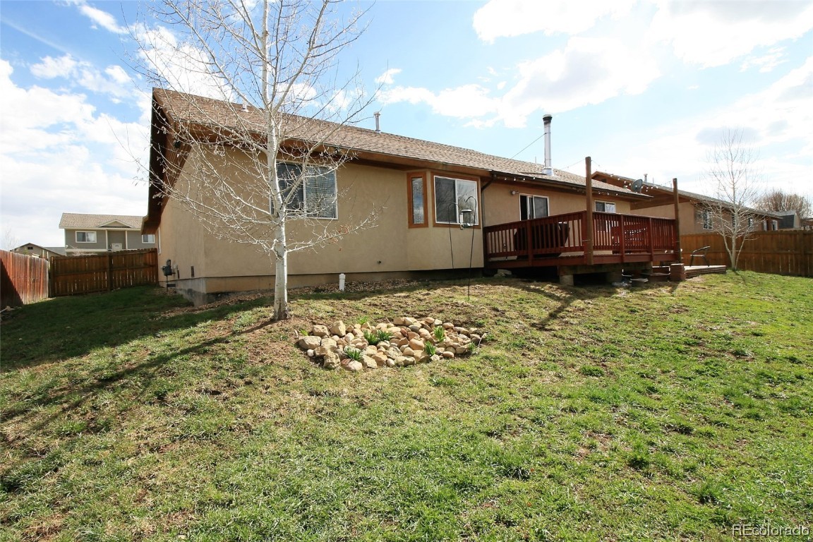 310 Honeysuckle Drive Hayden, CO 81639 - Photo 22 of 22 a backyard of a house with lots of green space