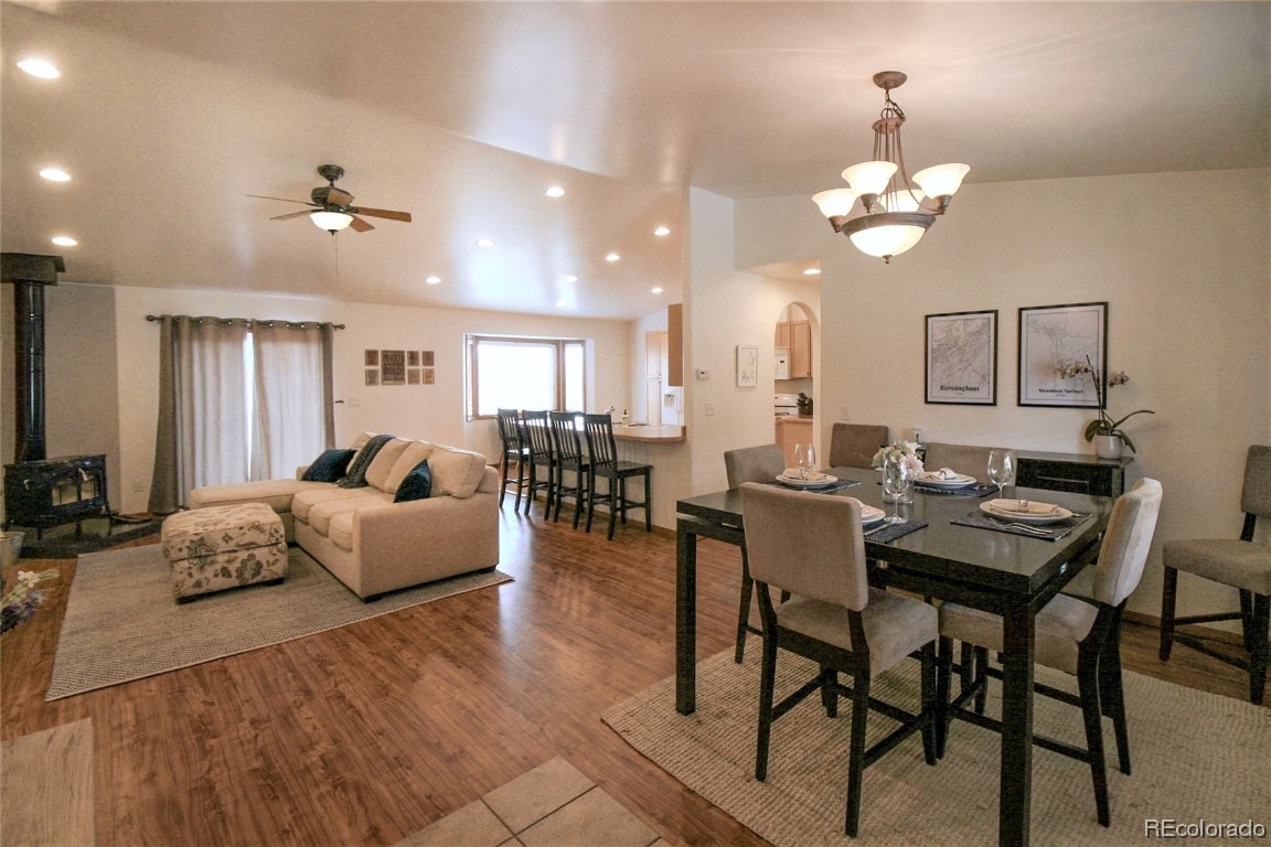 310 Honeysuckle Drive Hayden, CO 81639 - Photo 3 of 22 a living room with furniture kitchen view and a chandelier