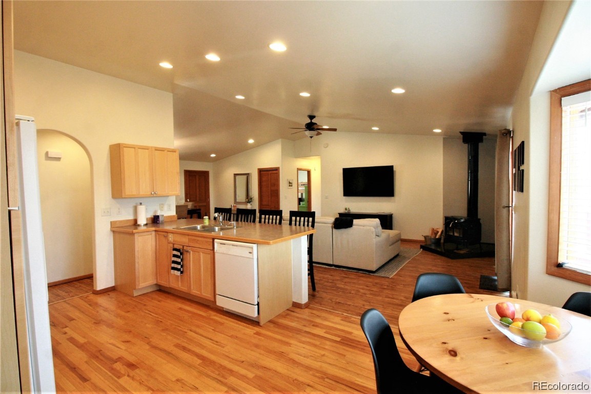 310 Honeysuckle Drive Hayden, CO 81639 - Photo 7 of 22 a living room with kitchen island furniture and a flat screen tv