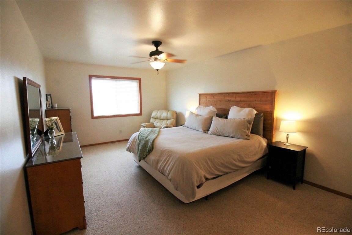 310 Honeysuckle Drive Hayden, CO 81639 - Photo 9 of 22 a bedroom with bed and window