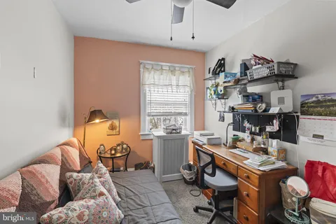 a workspace with furniture and window