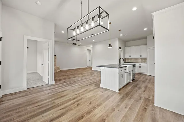 a house with swimming pool in front of it