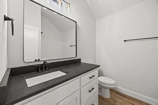 a spacious bathroom with a bathtub and a sink