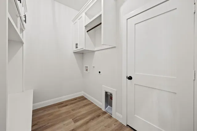 an empty room with a ceiling fan and window