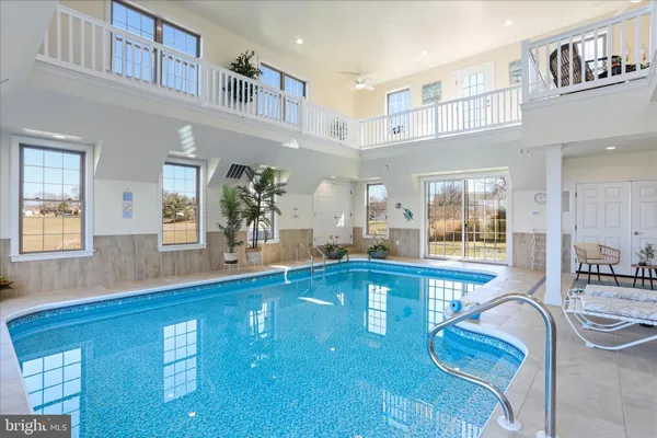 a kitchen with stainless steel appliances granite countertop a kitchen island a stove a table and chairs