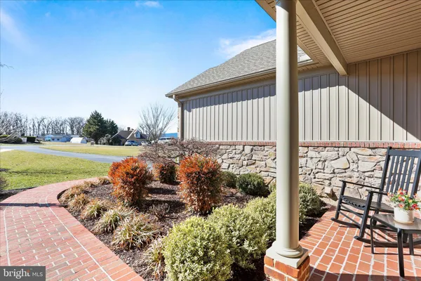 a kitchen with granite countertop a refrigerator and a sink