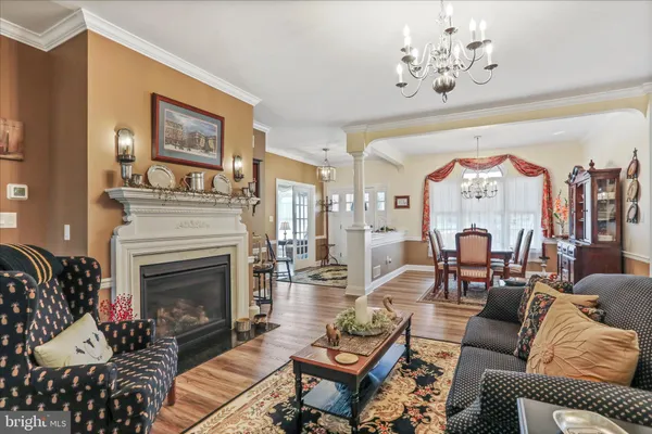 a living room with furniture and a book shelf