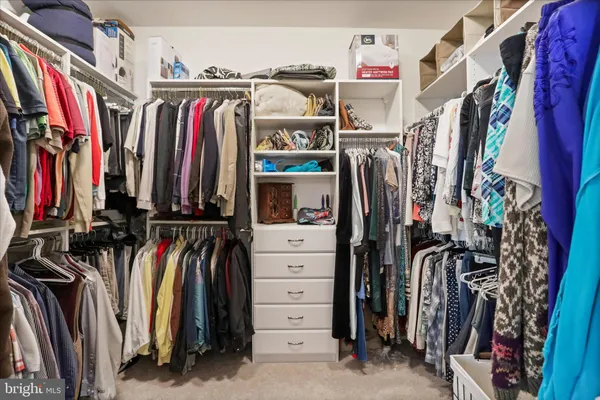 a bedroom with a bed and a mirror