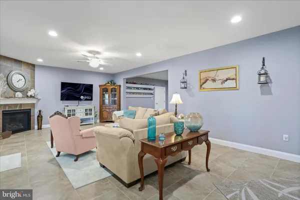 a front view of a house with a yard outdoor seating and garage