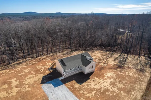 a view of a two chairs in a backyard