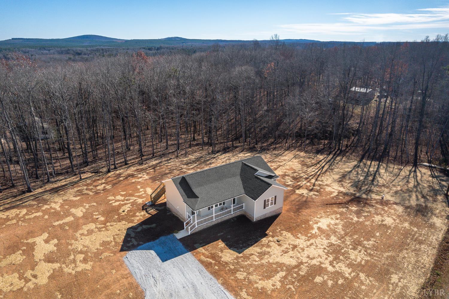 1720 Oak Rdg Road Appomattox, VA 24522 - Photo 11 of 53 a view of a two chairs in a backyard