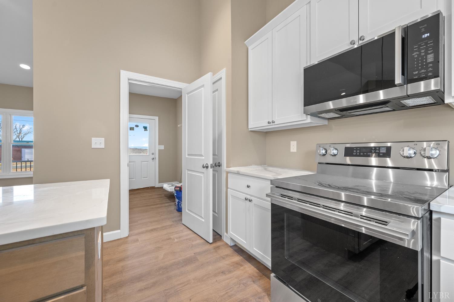 1720 Oak Rdg Road Appomattox, VA 24522 - Photo 18 of 53 a kitchen with stainless steel appliances a stove microwave and sink