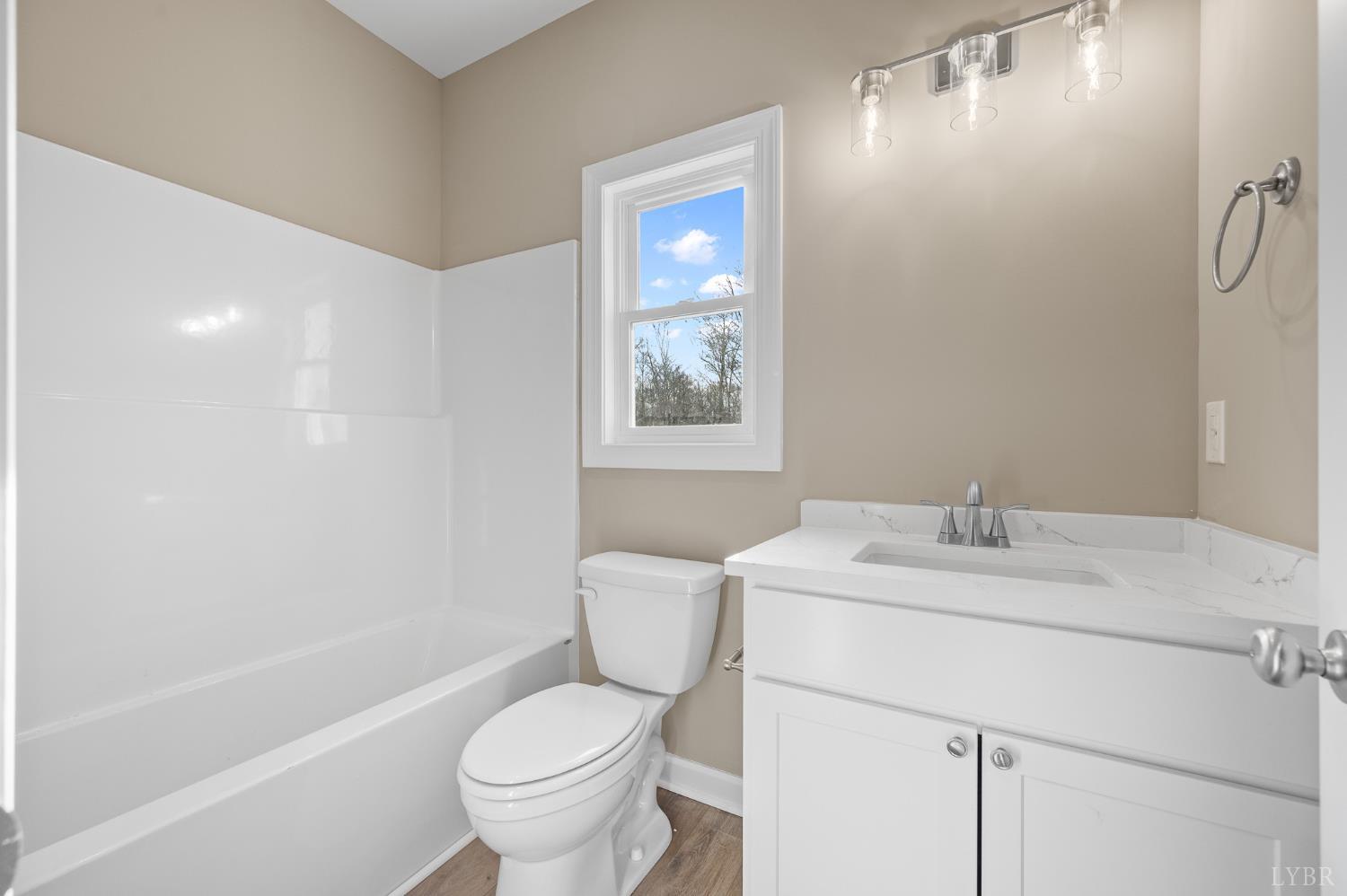 1720 Oak Rdg Road Appomattox, VA 24522 - Photo 19 of 53 a bathroom with a sink toilet vanity and tub