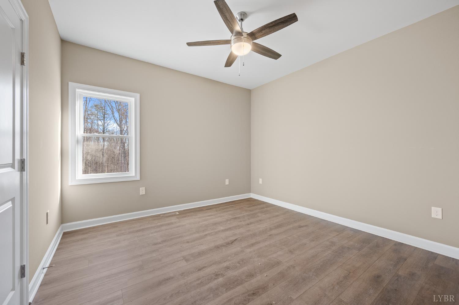 1720 Oak Rdg Road Appomattox, VA 24522 - Photo 22 of 53 an empty room with a window and a fan