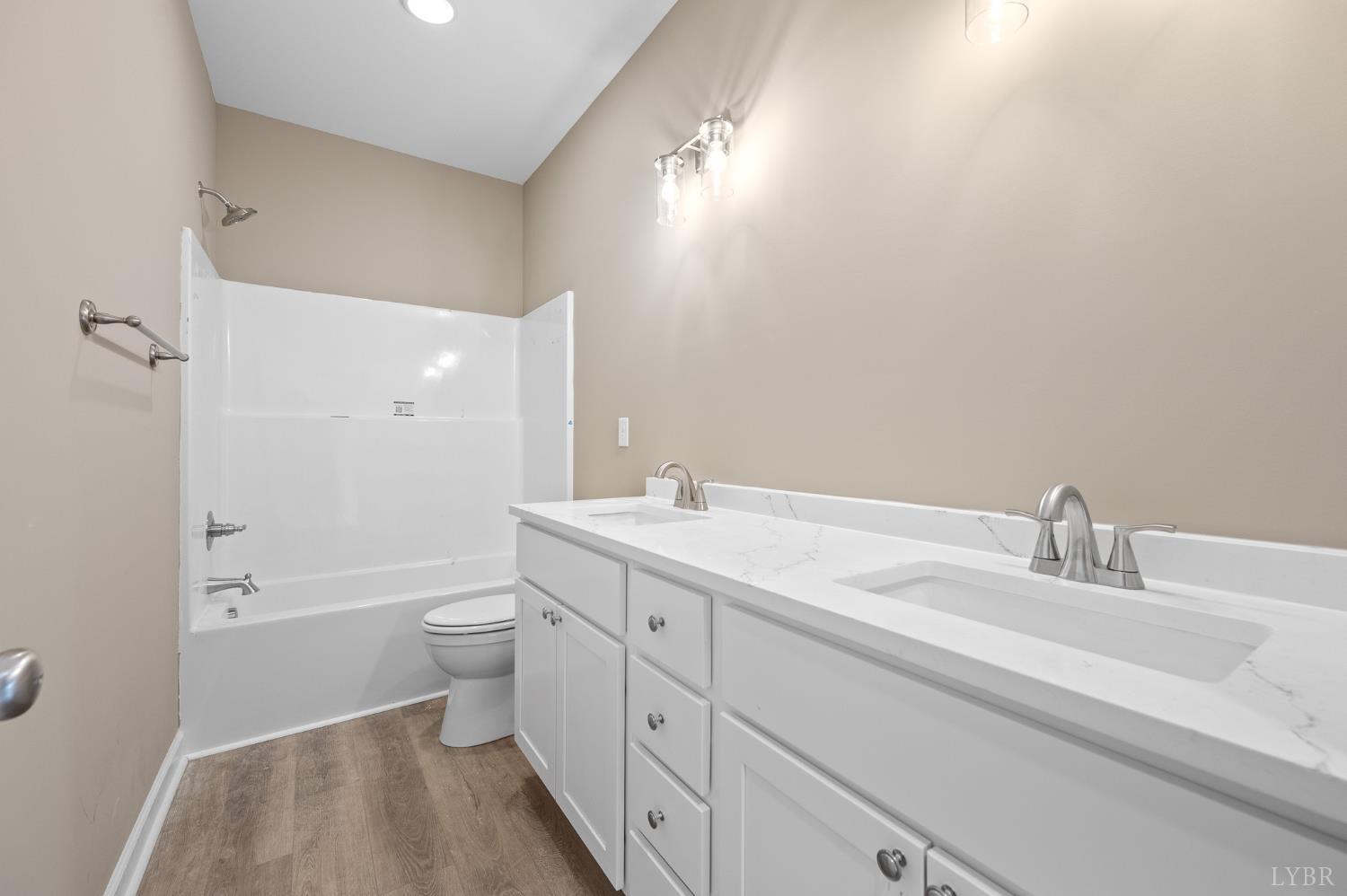 1720 Oak Rdg Road Appomattox, VA 24522 - Photo 38 of 53 a bathroom with a double vanity sink toilet mirror and bathtub