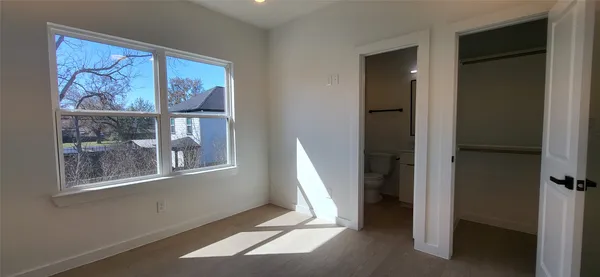 a view of a room with wooden floor and walls