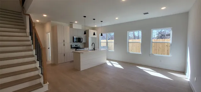 a view of a kitchen with furniture and a window