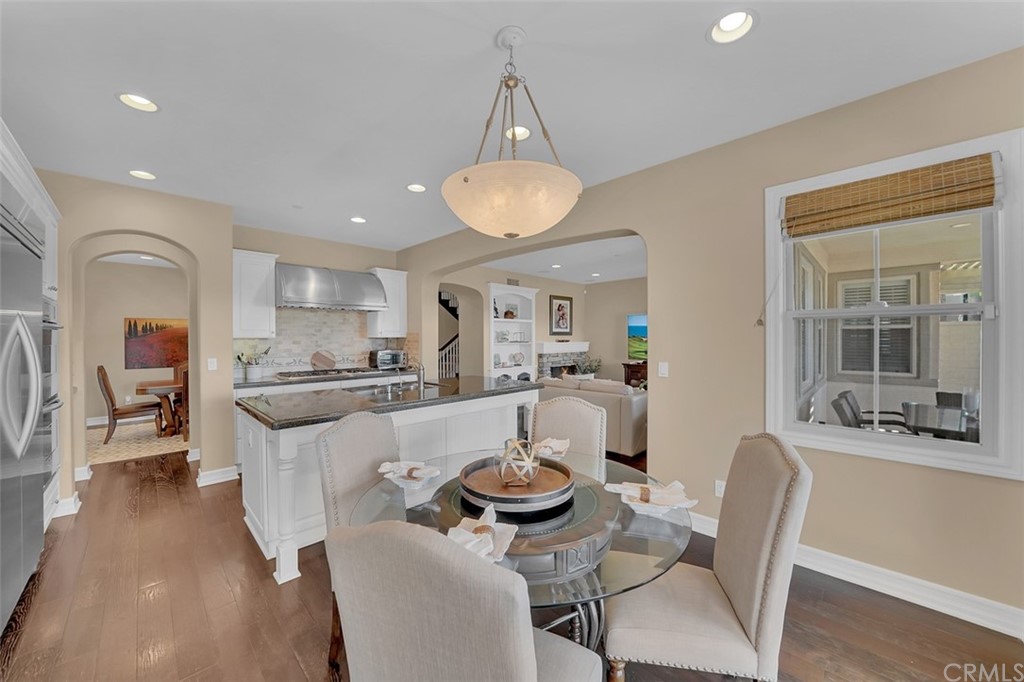 31 Via Soria San Clemente, CA 92673 - Photo 12 of 59 a large kitchen with a table and chairs