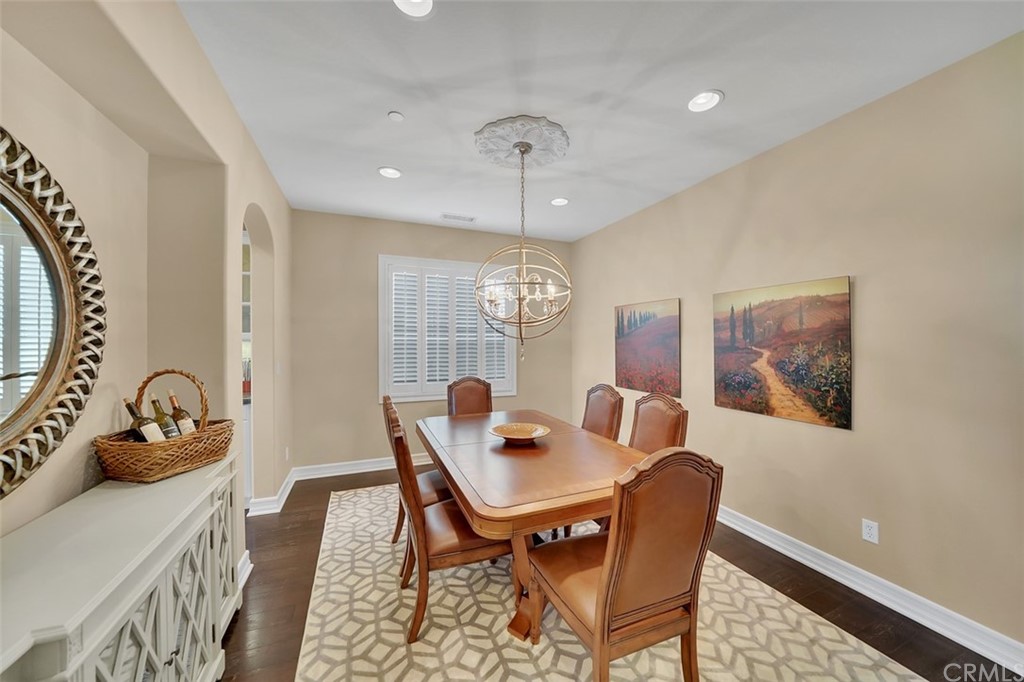 31 Via Soria San Clemente, CA 92673 - Photo 13 of 59 a view of a dining room with furniture window and wooden floor