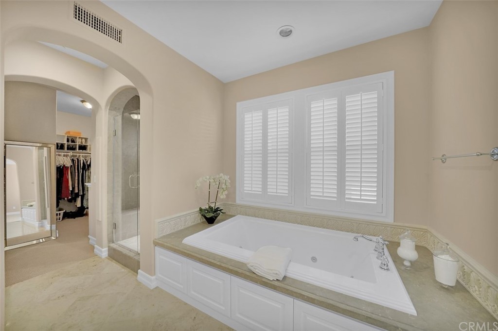 31 Via Soria San Clemente, CA 92673 - Photo 17 of 59 a spacious bathroom with a tub and a window