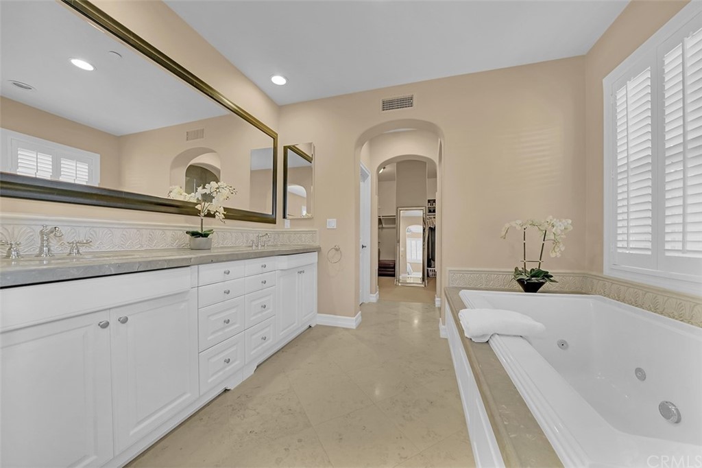 31 Via Soria San Clemente, CA 92673 - Photo 18 of 59 a spacious bathroom with a granite countertop sink mirror and bathtub