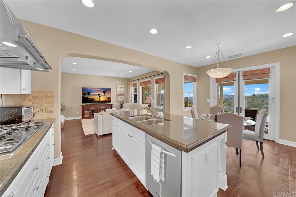31 Via Soria San Clemente, CA 92673 - Photo 3 of 59 a open kitchen with stainless steel appliances granite countertop a lot of counter space sink and stove