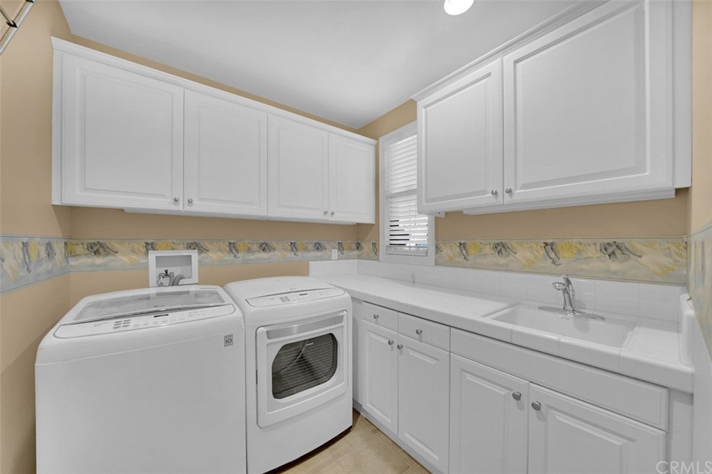 31 Via Soria San Clemente, CA 92673 - Photo 22 of 59 a view of a storage and utility room with washer and dryer