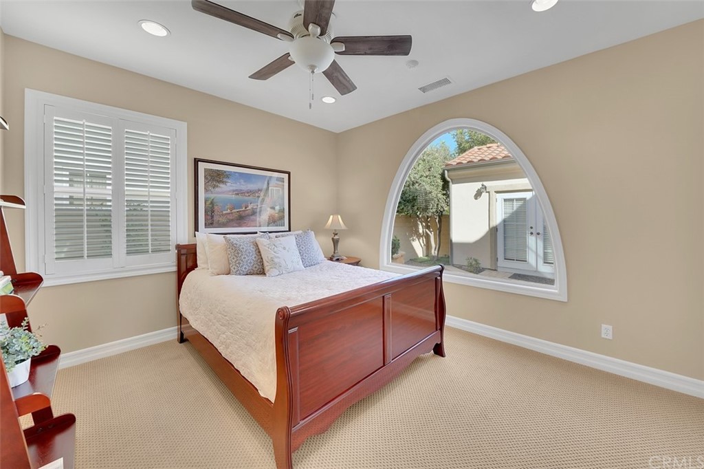31 Via Soria San Clemente, CA 92673 - Photo 23 of 59 a spacious bedroom with a bed a window and dresser