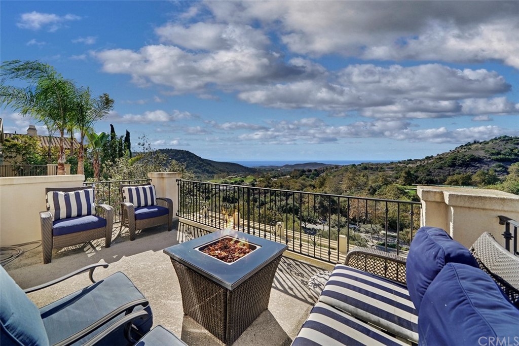 31 Via Soria San Clemente, CA 92673 - Photo 26 of 59 a view of a balcony with two chairs and a potted plant