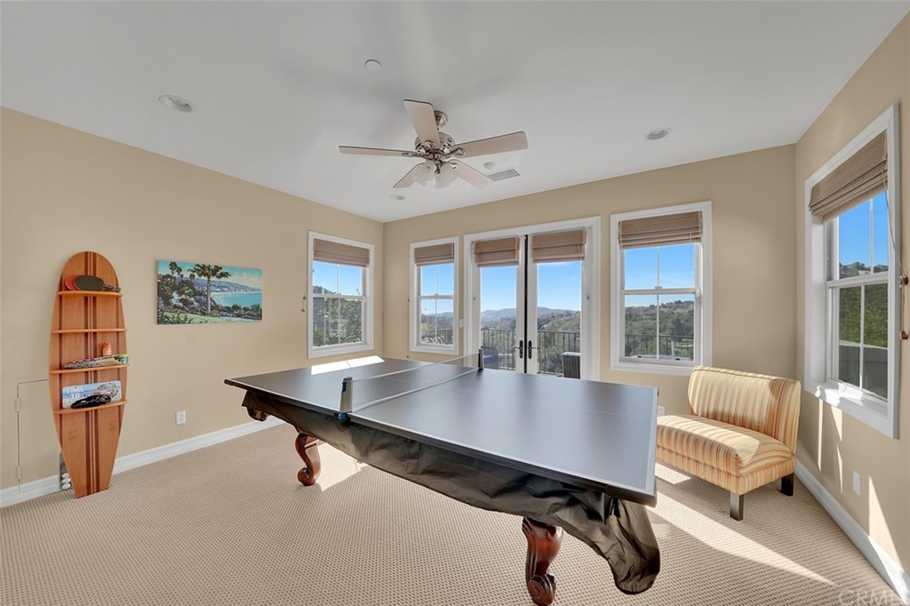 31 Via Soria San Clemente, CA 92673 - Photo 29 of 59 a living room with furniture a table and large windows