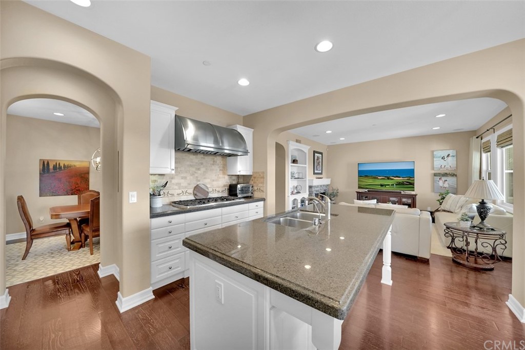 31 Via Soria San Clemente, CA 92673 - Photo 4 of 59 a living room with stainless steel appliances furniture wooden floor and a kitchen view