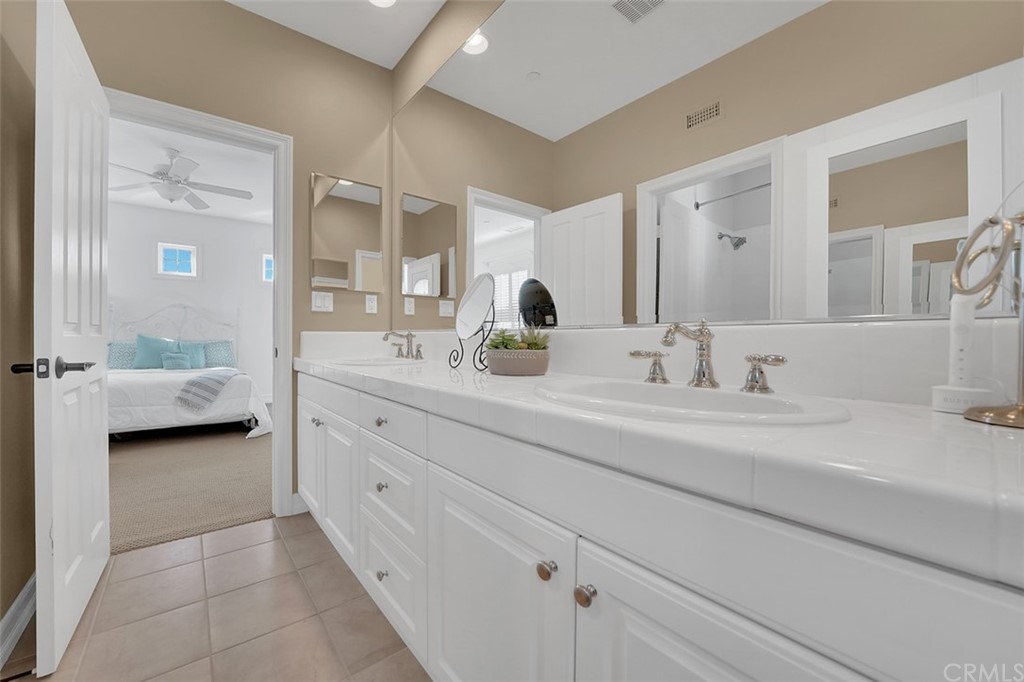 31 Via Soria San Clemente, CA 92673 - Photo 33 of 59 a en suite bathroom with a double sink double vanity and a mirror