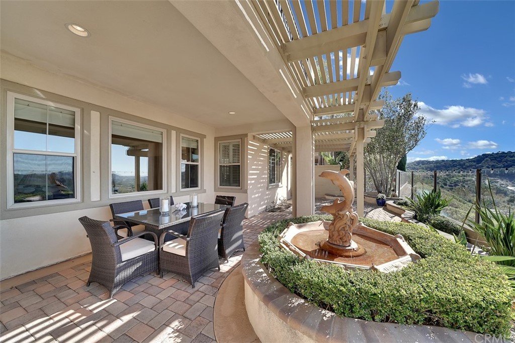 31 Via Soria San Clemente, CA 92673 - Photo 40 of 59 a living room with furniture a chandelier and a large window